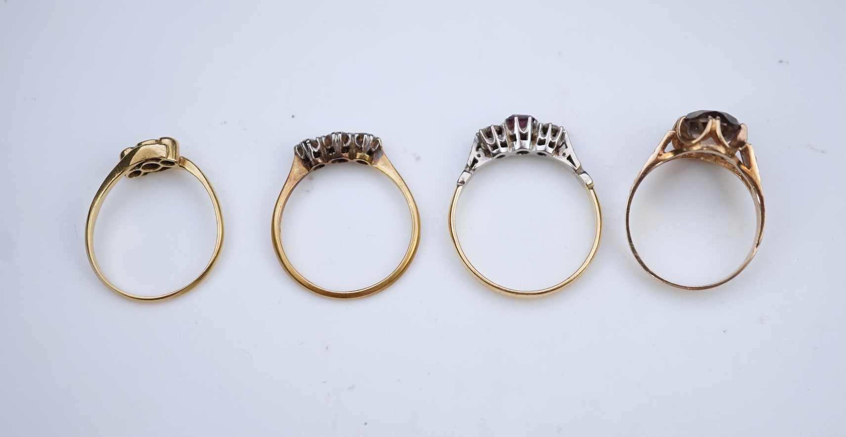 Four gem-set rings